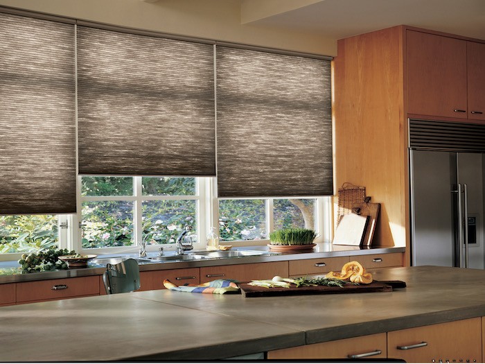 A kitchen with countertops made from different materials.